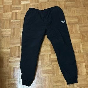 Plain black Reebok track pants